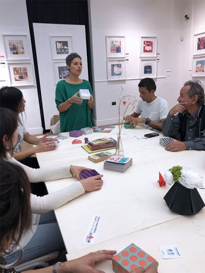 Maria Assunta De Fazio, designer, shows some products realized with paper by hand to participants at her “Geometrie in origami” creative table during the Cose Belle Festival 2019.