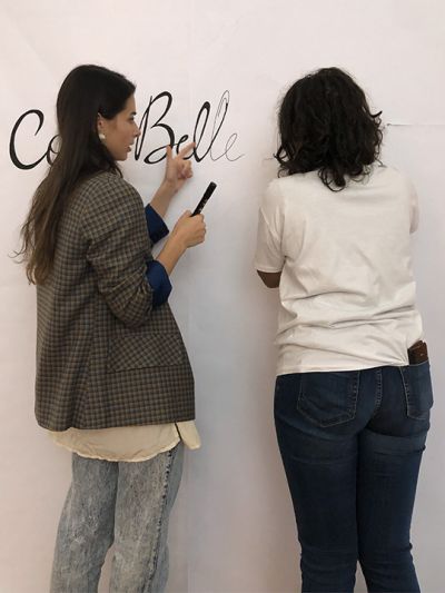 Arianna D’Agostino and Darina Birulina, illustrators of the team, works together for drawing and painting the paper on the walls of the museum windows during the preparation phase of the Cose Belle Festival 2019.