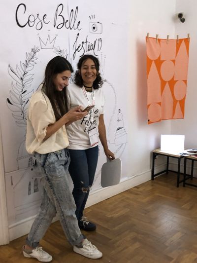 Arianna D’Agostino and Darina Birulina, illustrators of the team, joke near the Photo Boot station during during the Cose Belle Festival 2019.